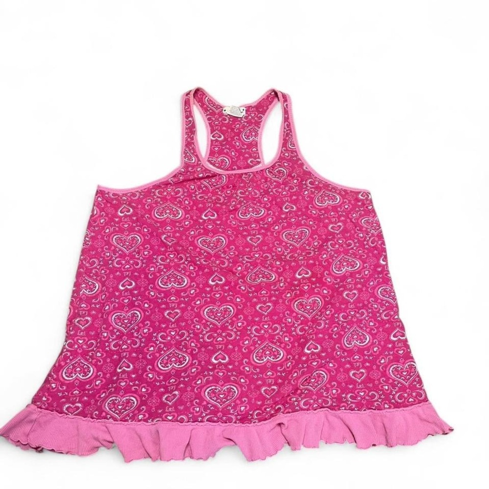Pink heart print tank top with ruffle hem.